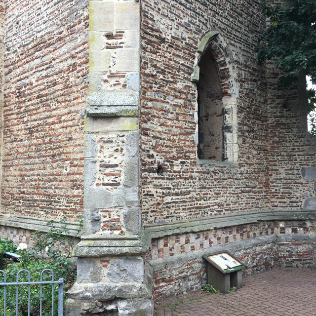 The west tower of All Saints' church with check pattern