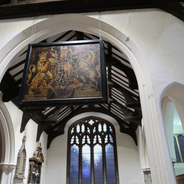 The Royal Arms of Charles II hanging in the Chancel arch