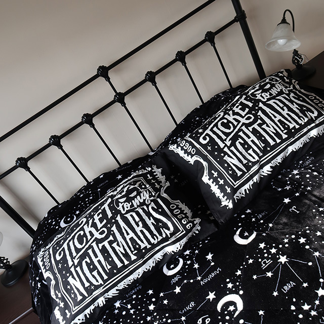 Killstar's Ticket To My Nightmare Pillowcases on a bed