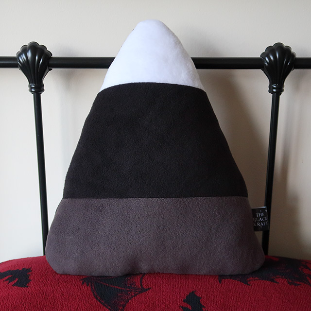 A monochrome Candy Corn cushion by Sew Haunting