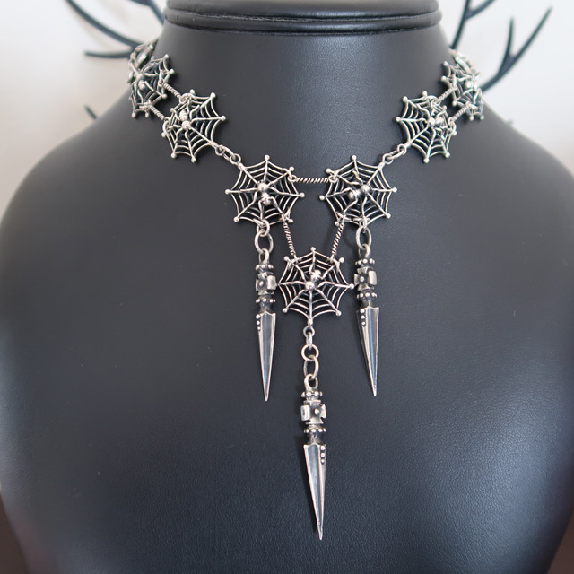 A large spiderweb necklace in sterling silver