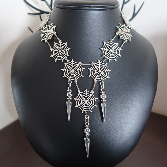 A large spiderweb necklace in sterling silver