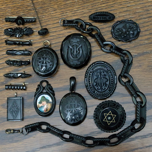 A collection of black jewellery items; jet and very likely some Vulcanite