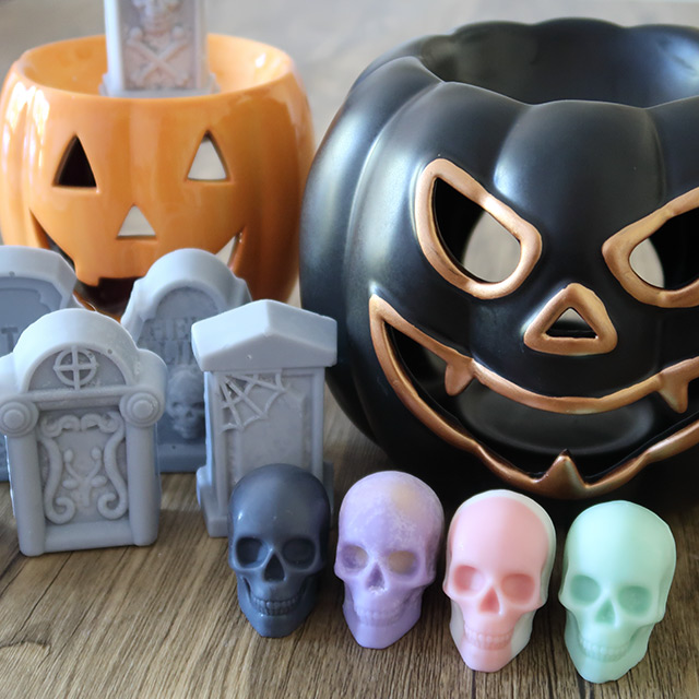 Wax melts by the Cosy Crypt (shown with Yankee Candle pumpkin-shaped burners