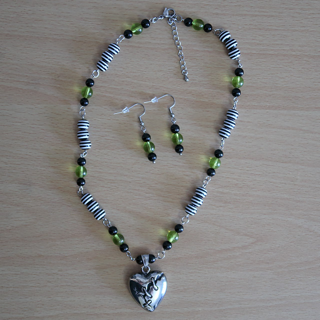 Broken Heart necklace and earrings (overhead view)